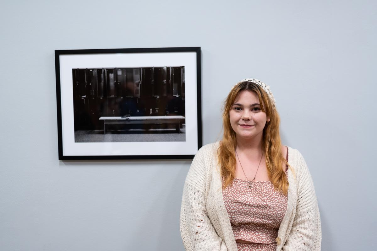 Makenzie Hillegass next to her photo submission at Arcadia Exhibitions