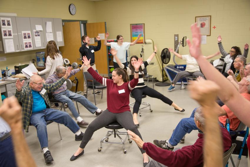 Students work with patients in the Stay Fit program.