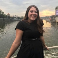 Amelia Mundell at the railing of a boat.