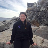 Ashley Kleeberg sitting on rocks