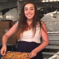 A portrait of a woman baking in a kitchen