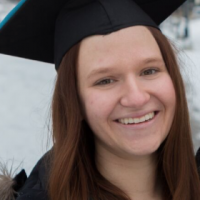 A headshot of a woman wearing a graduation cap