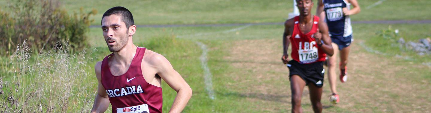 Cross country athletes running for a race.