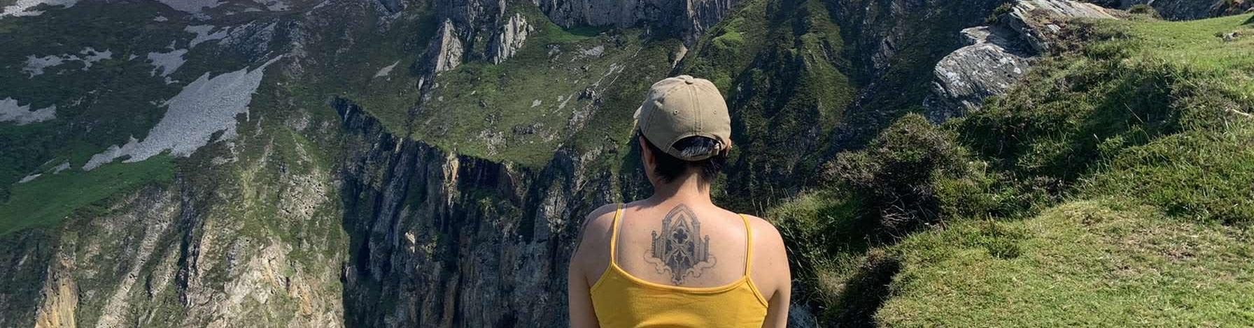 A person looking over a cliff