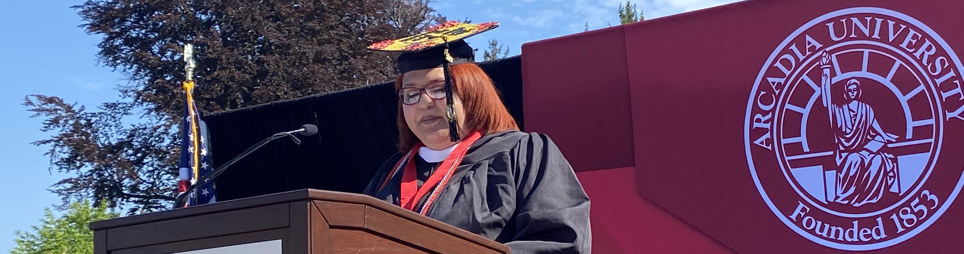 A woman giving a graduation speech