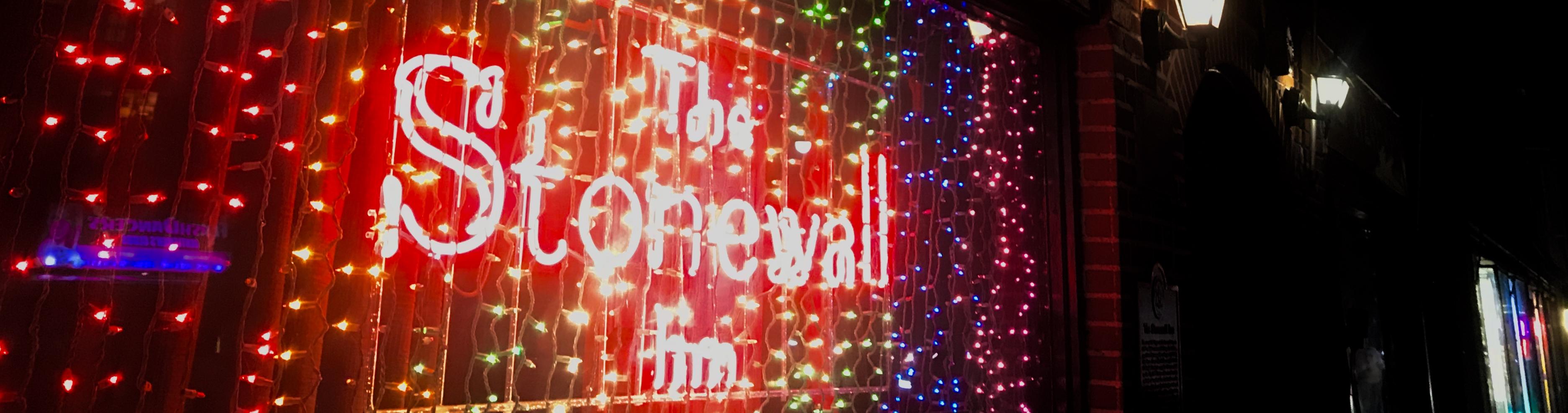 Picture of lights with the florescent sign The Stonewall Inn.