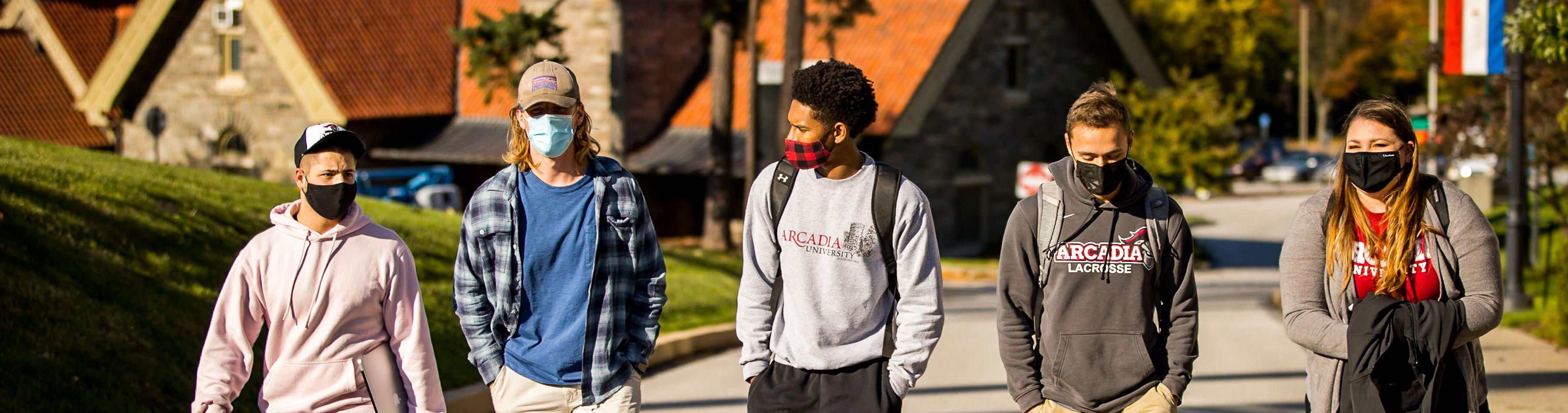 Four students walking together on Arcadia Campus.