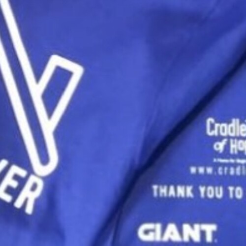 close up shot of t-shirt logo for Run For Cover Cradle of Hope 5K event