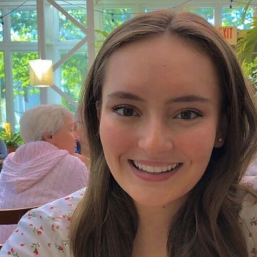 Smiling headshot of a female student in a local restaurant