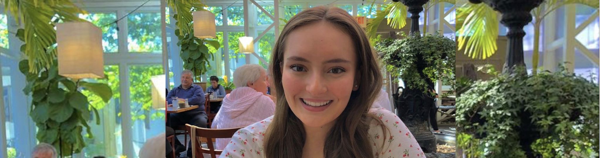 Smiling headshot of a female student in a local restaurant