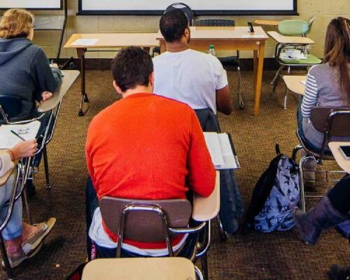 Students sitting in desks in a classroom