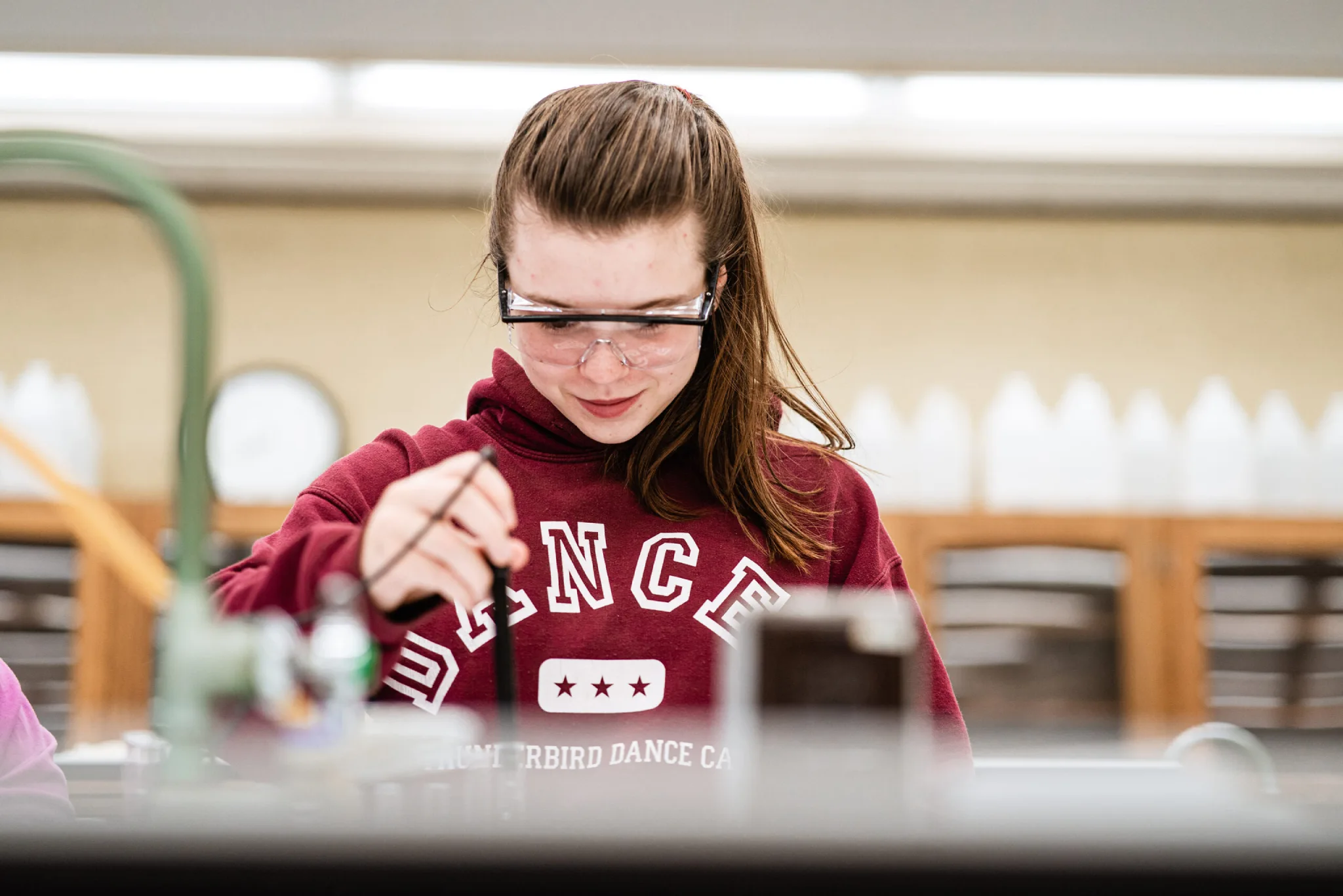 Student working in a lab in a dual degree program