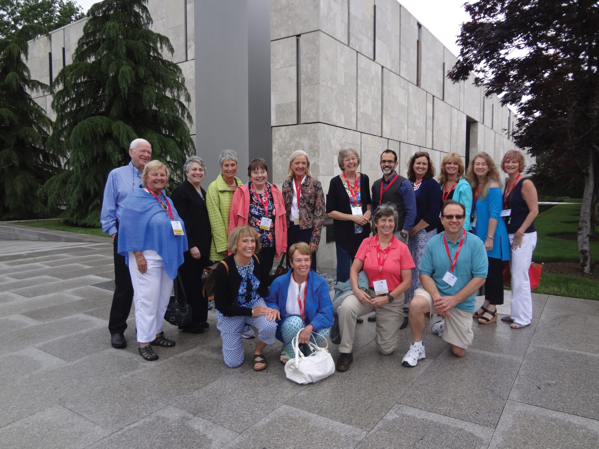 A group of alumni student posing together outside