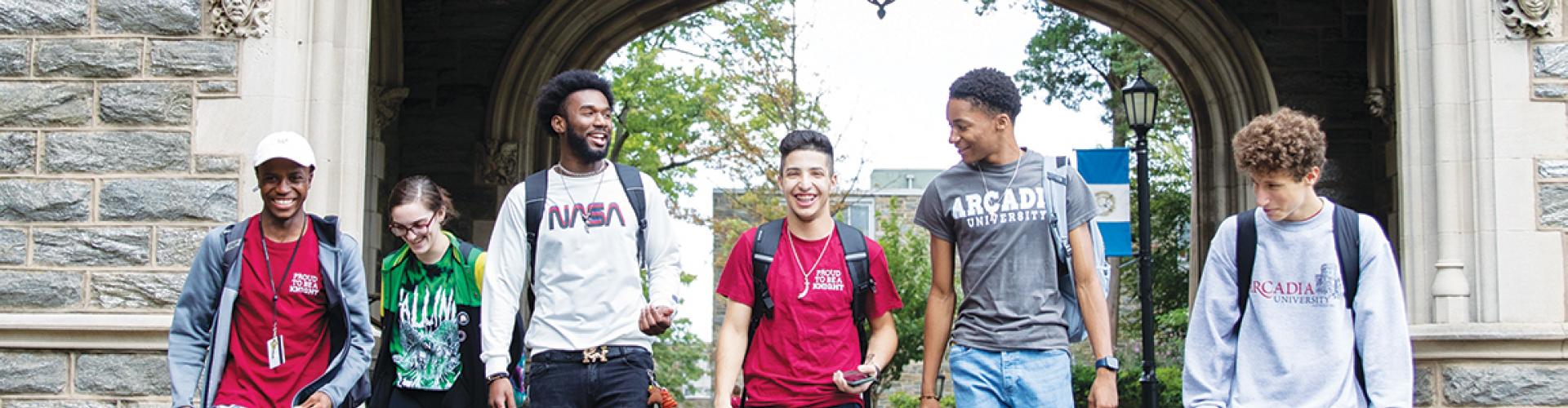 Six students walking and talking together.