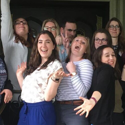Class of 2020 students pose for a funny photo in front of the castle.