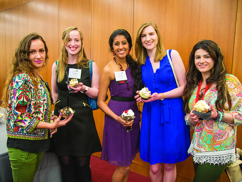 Group photo of alumni students eating ice cream