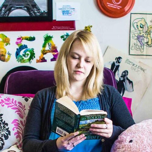 A student in her dorm reading a book