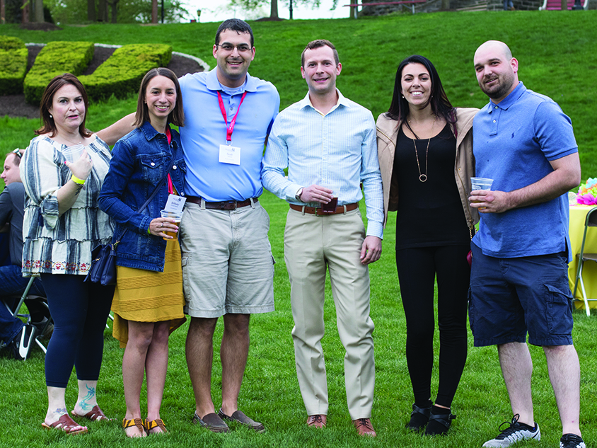 A group of people posing together at an event on Haber Green
