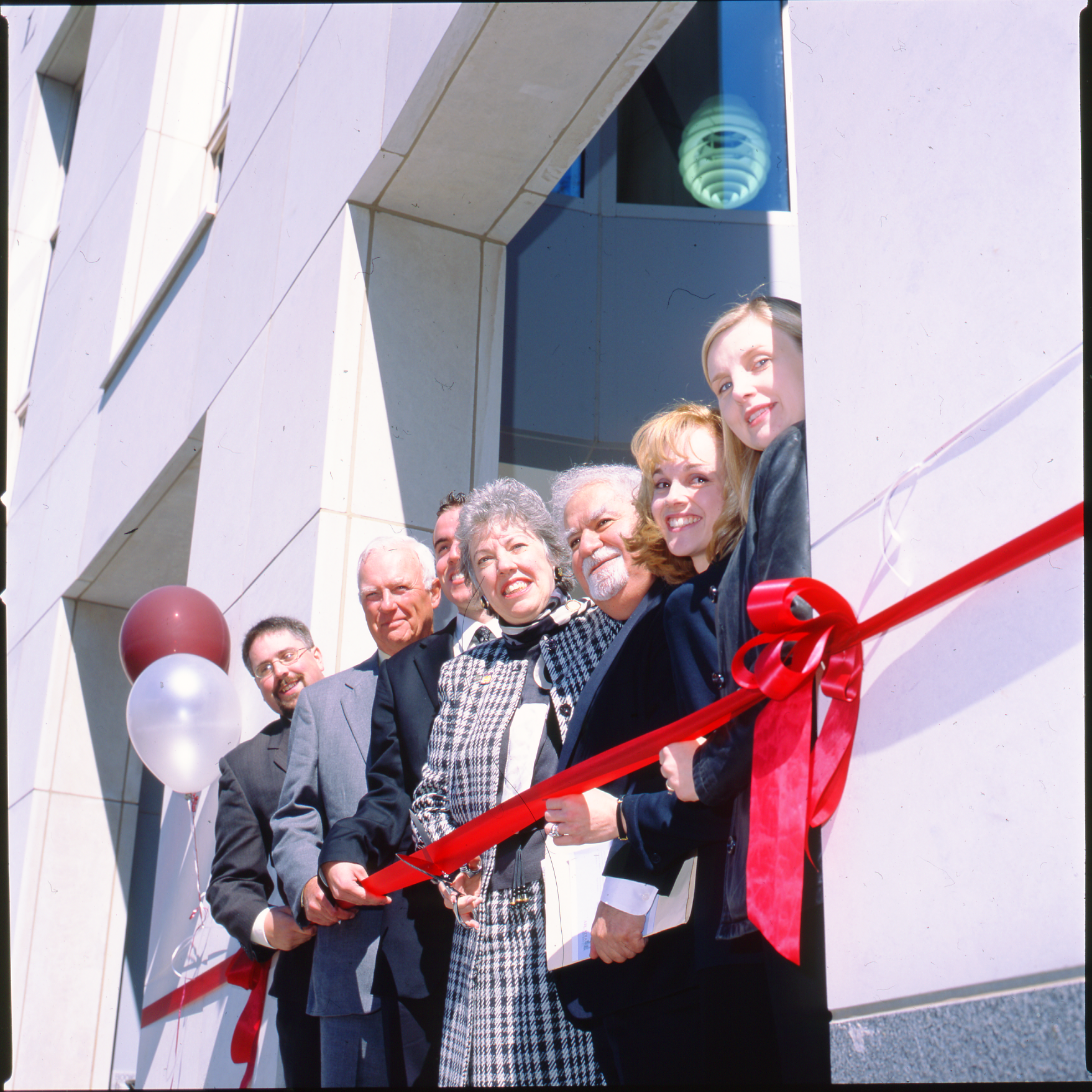 President Emerita Dr. Bette E. Landman cuts the ribbon at the dedication in 2003.