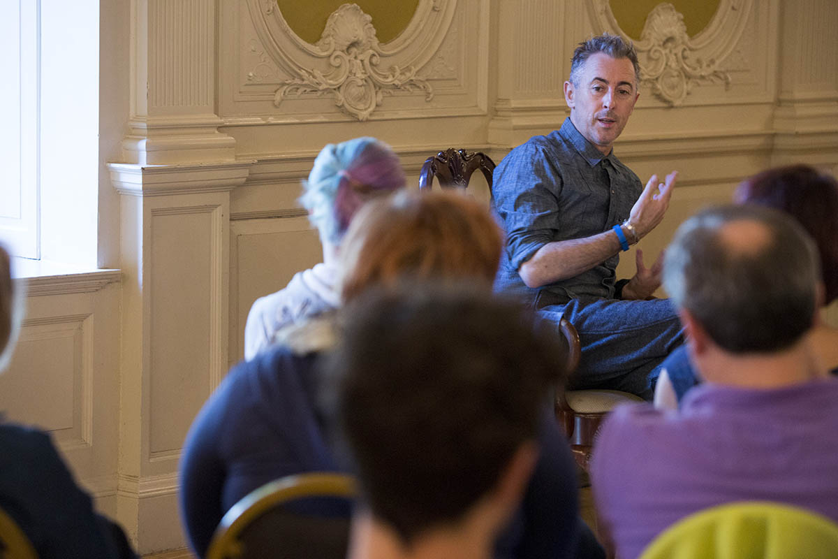 Alan Cumming in the Mirror Room in Grey Towers looking at the audience