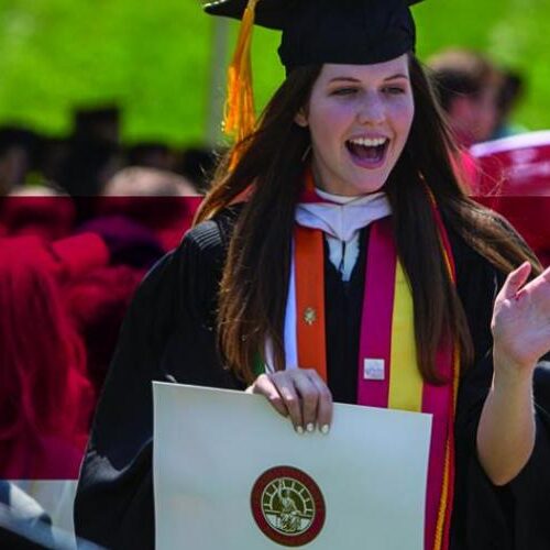 A 2016 graduate receiving her diploma.