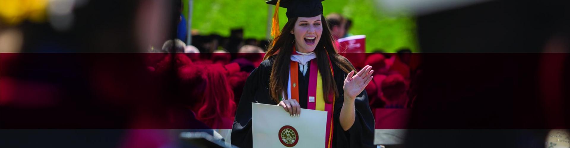 A 2016 graduate receiving her diploma.
