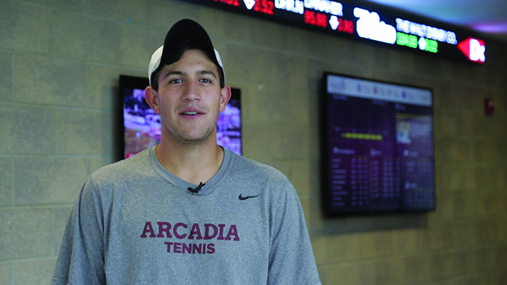 A photo of Vincent Voulo wearing a cap and Arcadia Tennis t-shirt