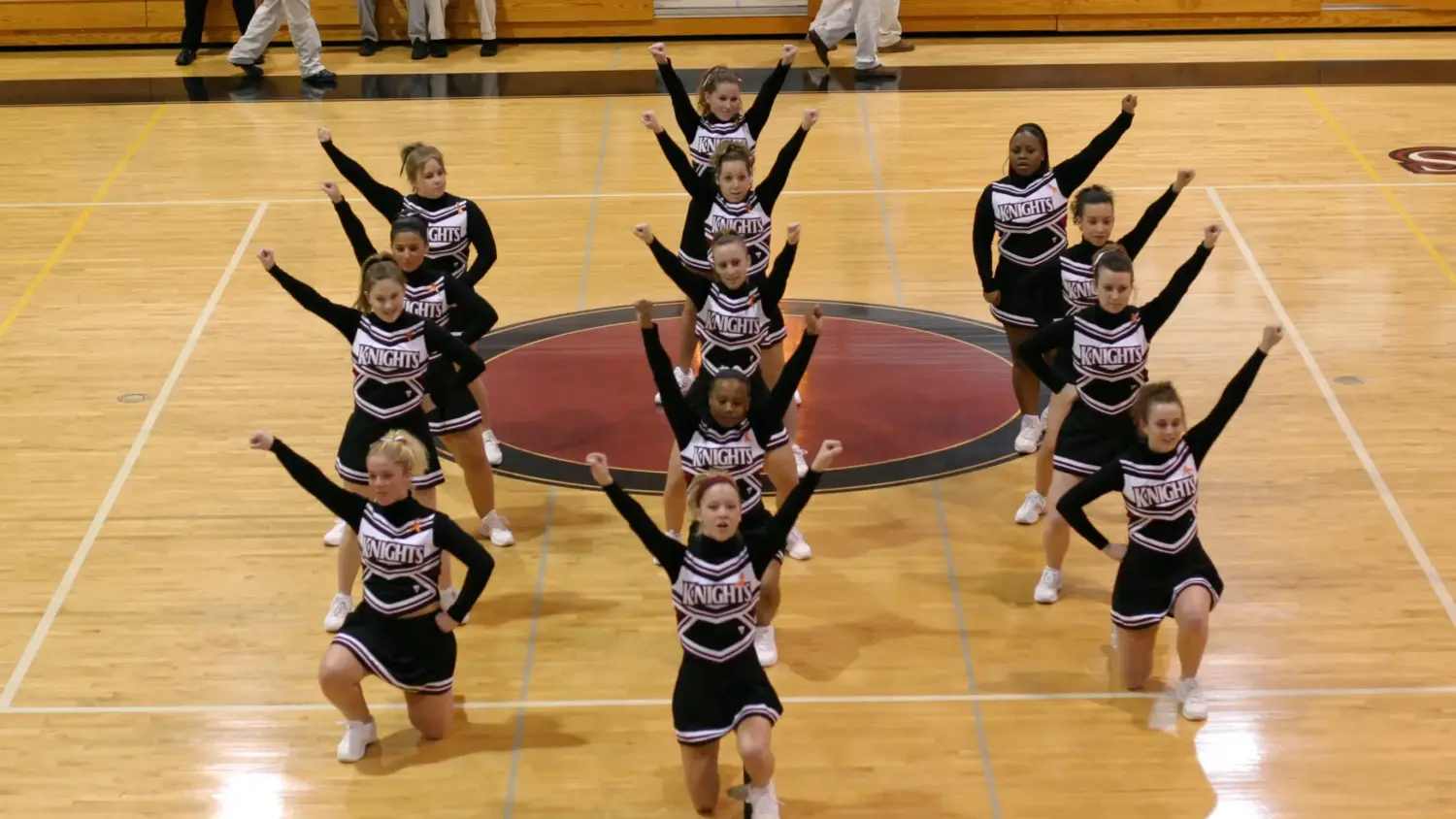Arcadia University's cheer team performs during a 2005 basketball game.