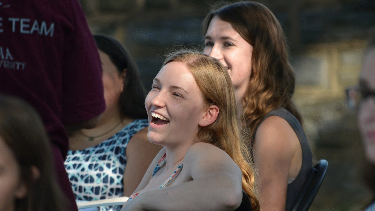 Students attend an honors event.