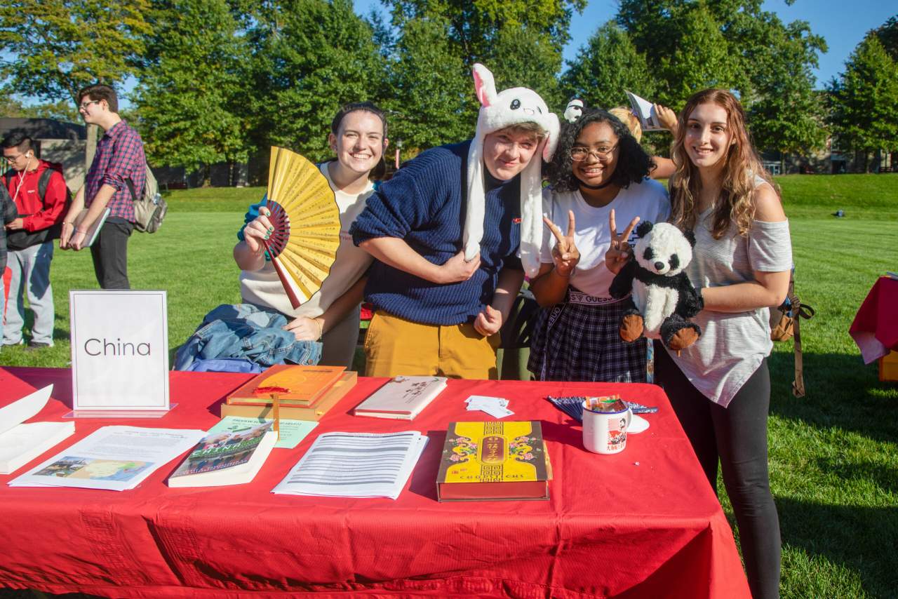 Four students hosting the China table for Preview Kick-off.