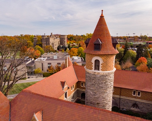 Drone view of Murphy Hall with Grey Towers Castle in the background.