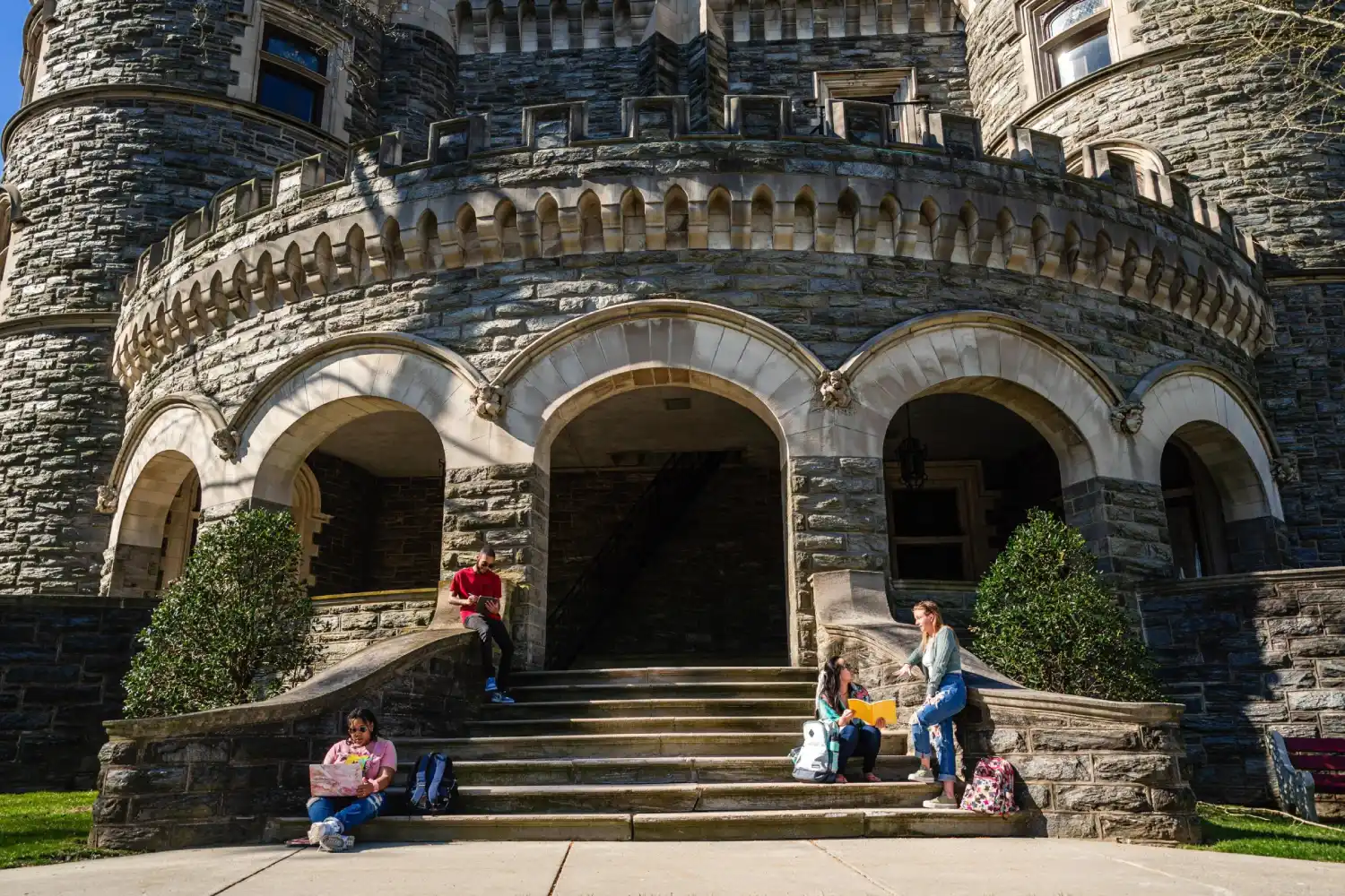 Group of students studying on the steps of Grey Towers Castle