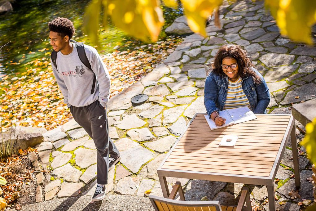 Two undergraduate students enjoy the fall colors on campus.