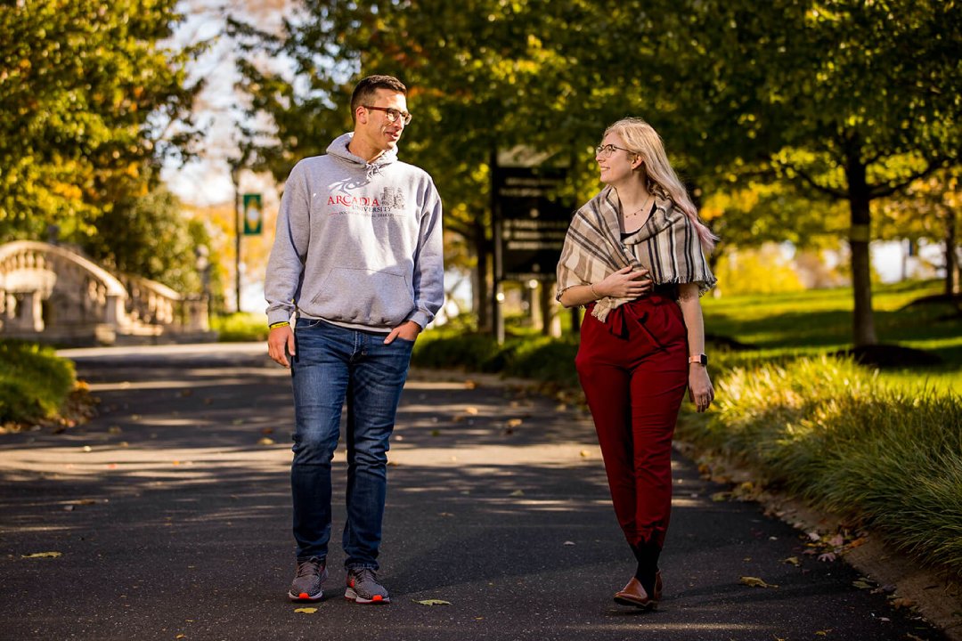 Graduate students take a walk on campus in the fall.