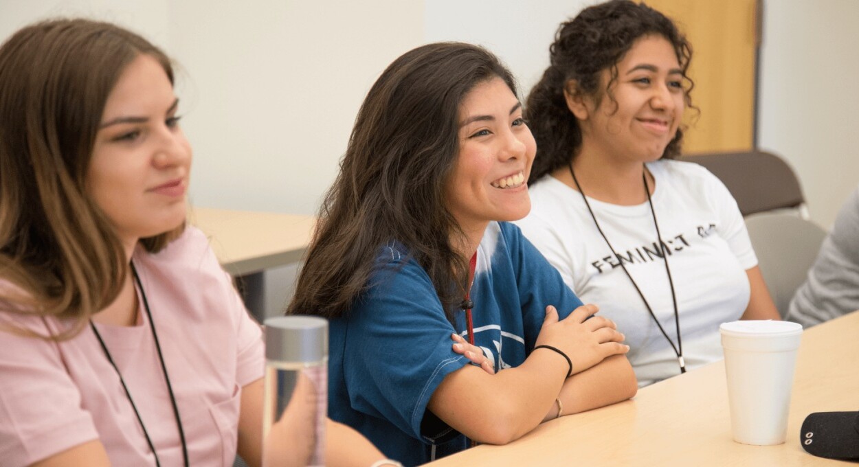 Three students sitting in class