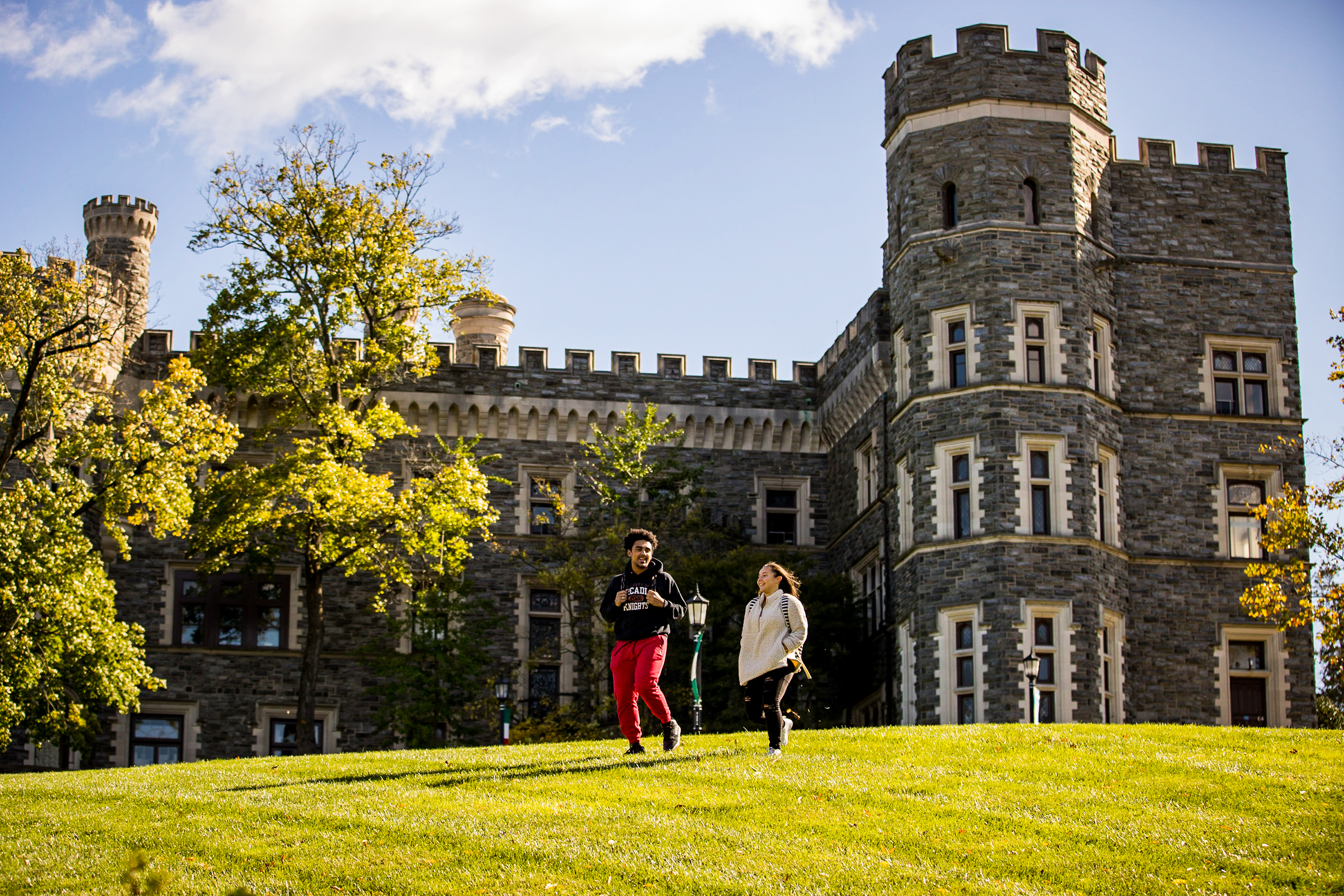 Students walk by Grey Towers.