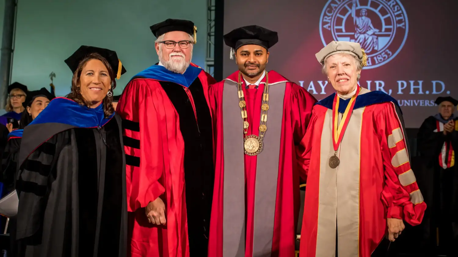 President Ajay Nair stands with colleagues at inauguration ceremony