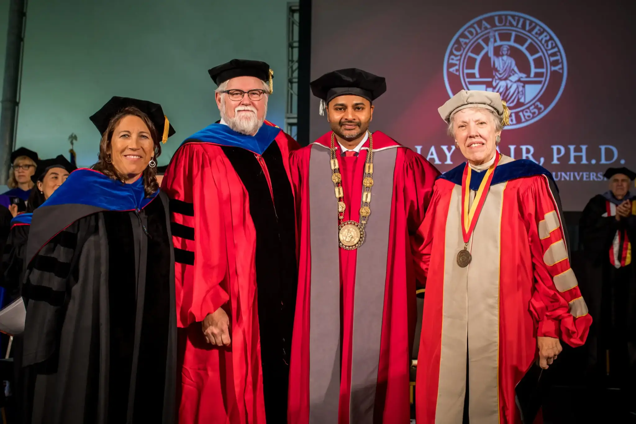 President Ajay Nair stands with colleagues at inauguration ceremony
