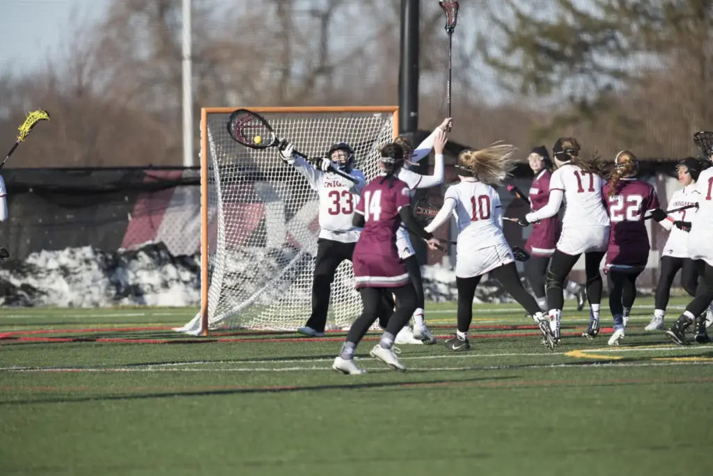 Women's Lacrosse goalie makes a save on a cold day vs. Eastern University