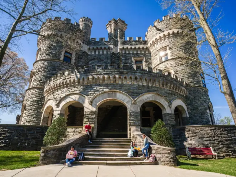 Students sit outside of Grey Towers Castle.