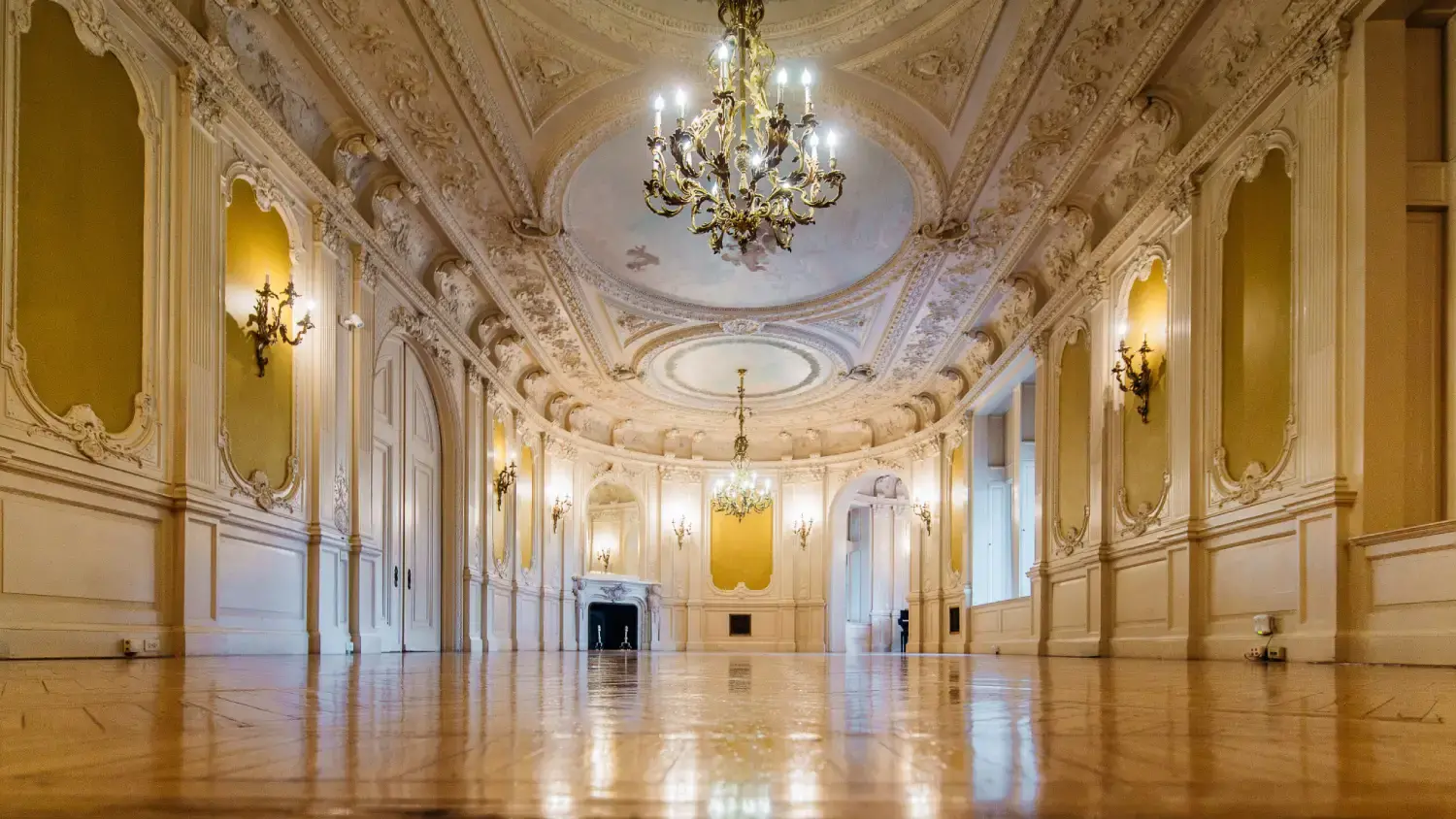 Interior room with ornate ceiling and chandelier in Arcadia University's Greys Tower Castle