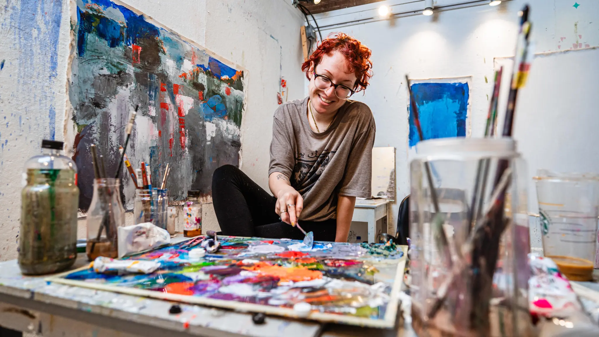 A student works with a colorful art palette.