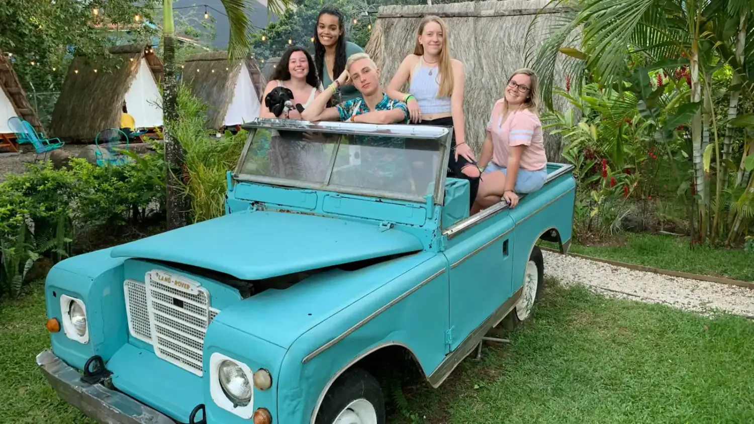 Students pose in an old care in Costa Rica