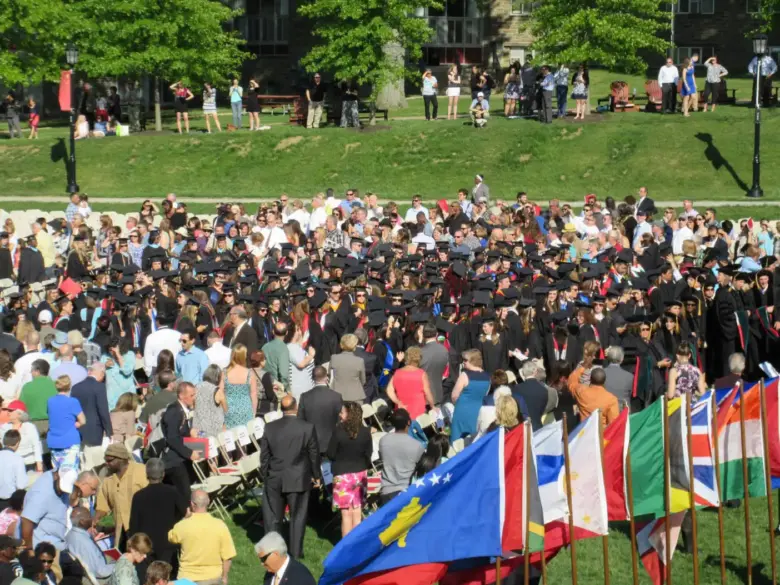 IPCR students and flags at a graduation ceremony