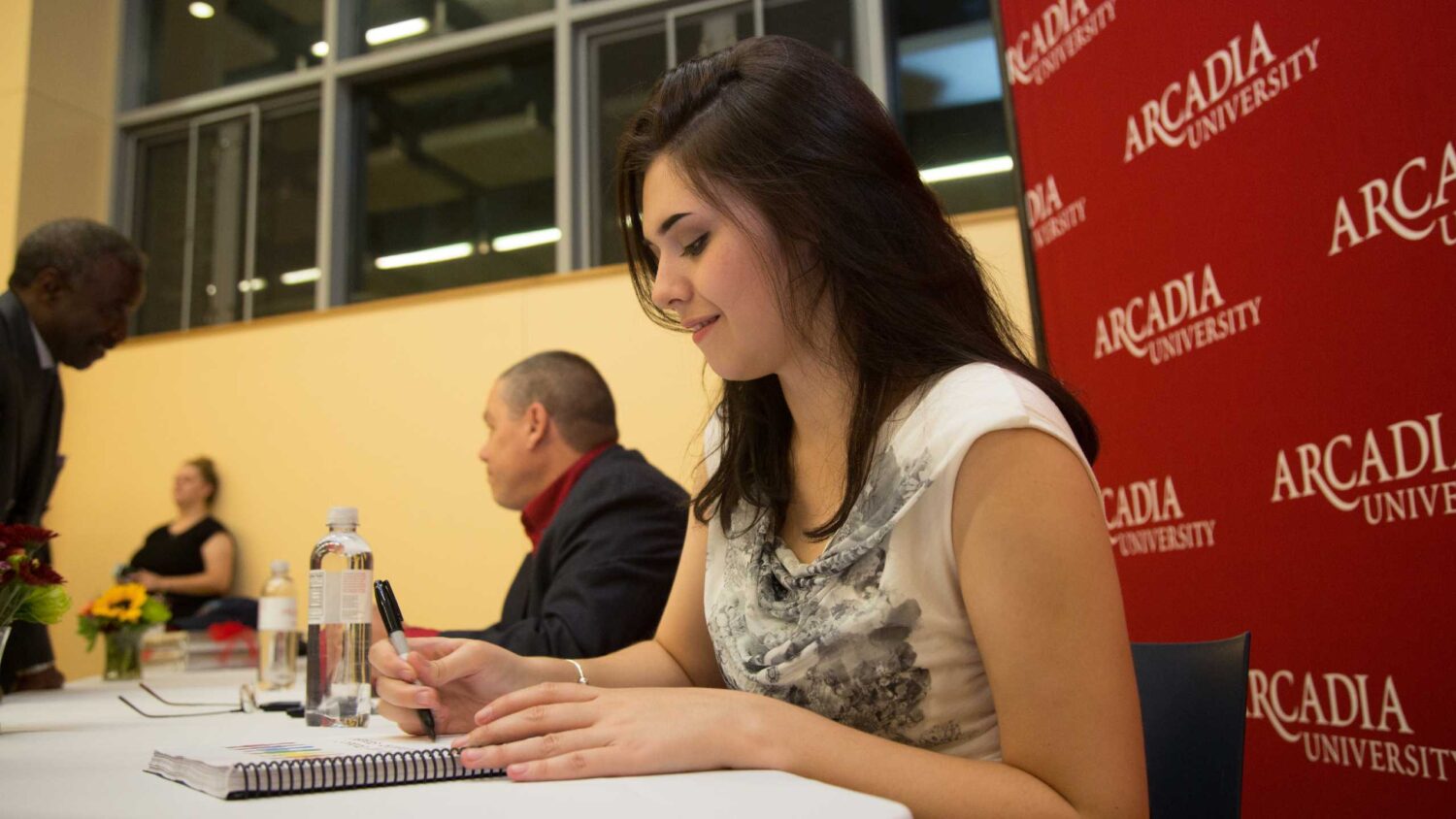 Nicole Maines signs her book, Becoming Nicole.