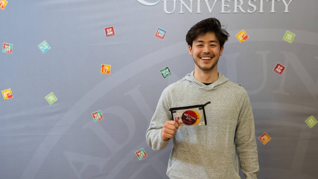 One of the winners of the Preview Photo and Video Contest poses with his prize