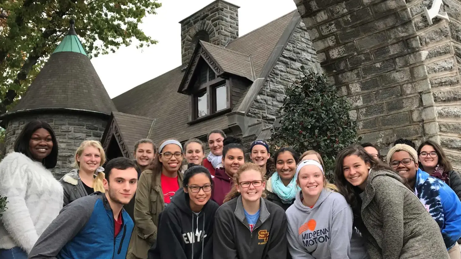 Group of students smile at the camera