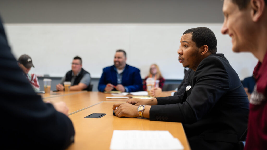 Students listen to a capstone discussion.