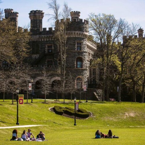 Arcadia Grey Towers Castle exterior with students gathered in groups on the lawn