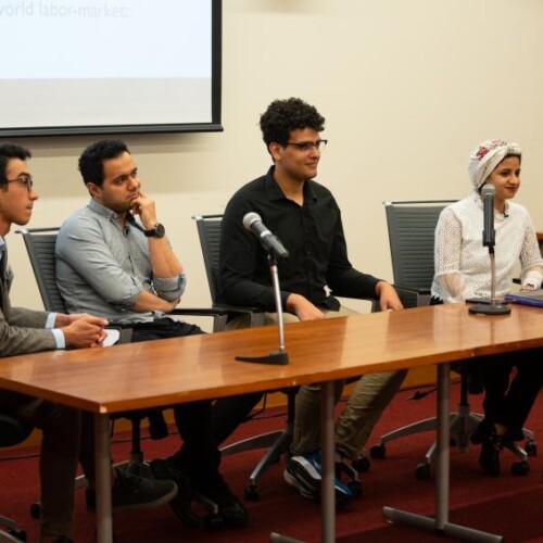 Several Egyptian students seated at the Egyptian STEM Student Showcase at Arcadia University